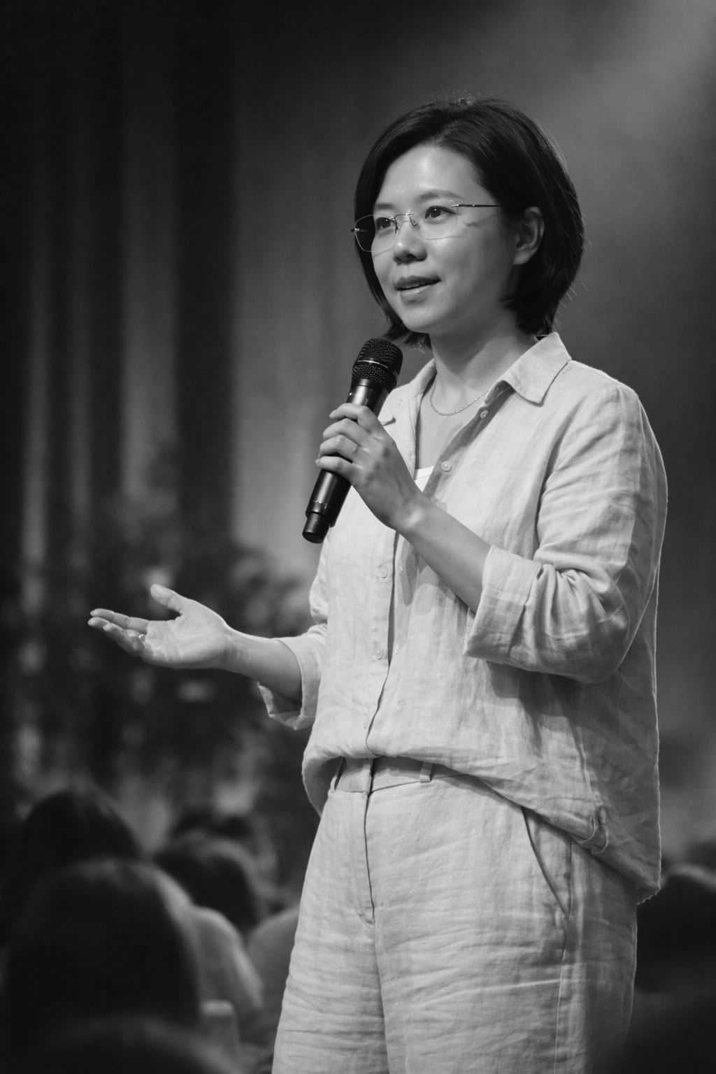 Aknes Kendra speaking on stage